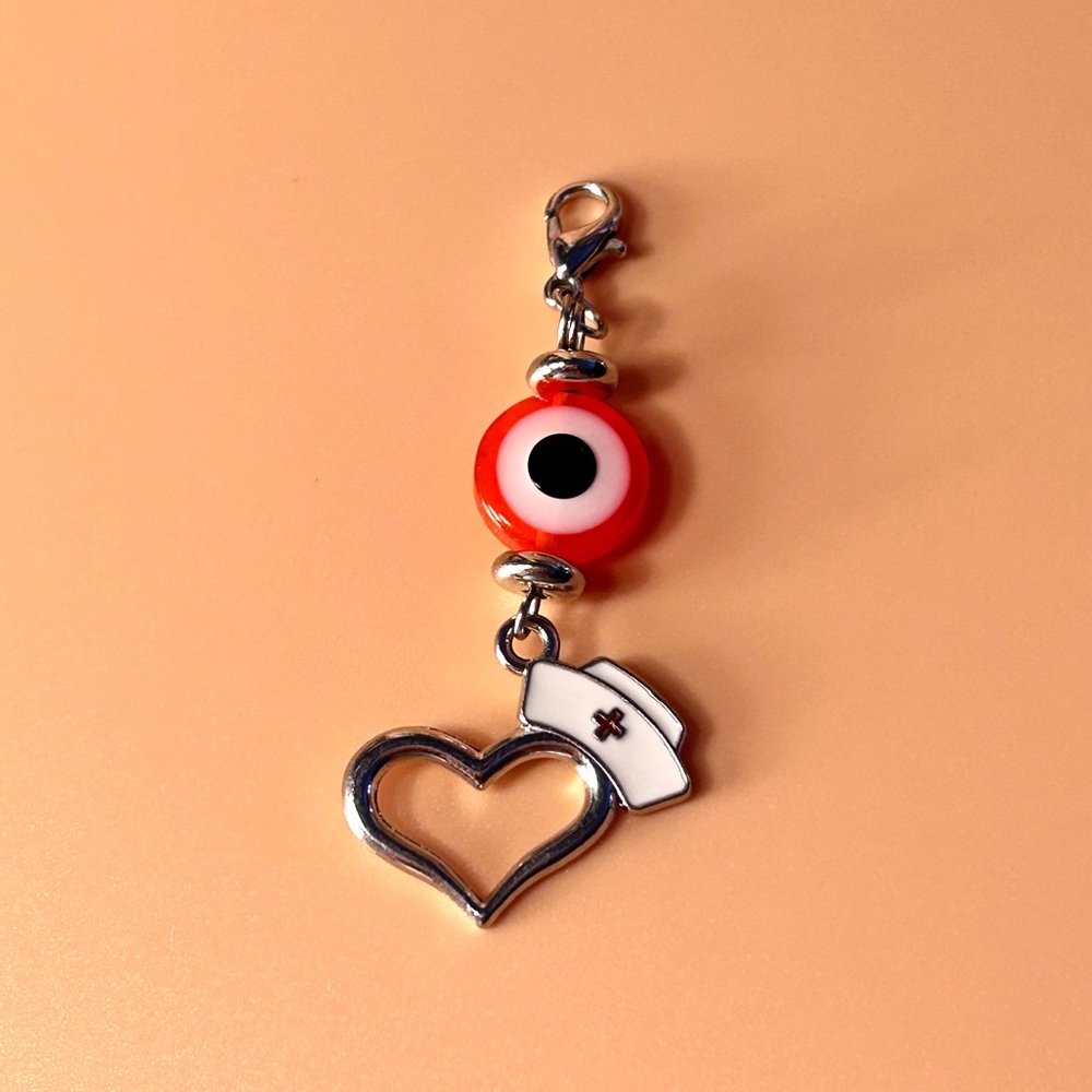 🧡🧿 Evil Eye Badge Reel Charm